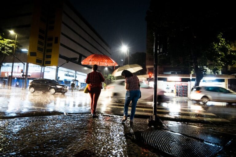 rainy city street umbrella