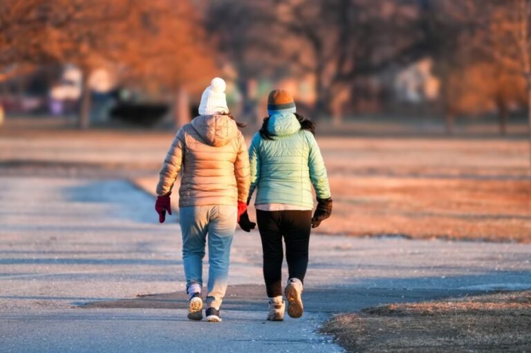 two people walking park